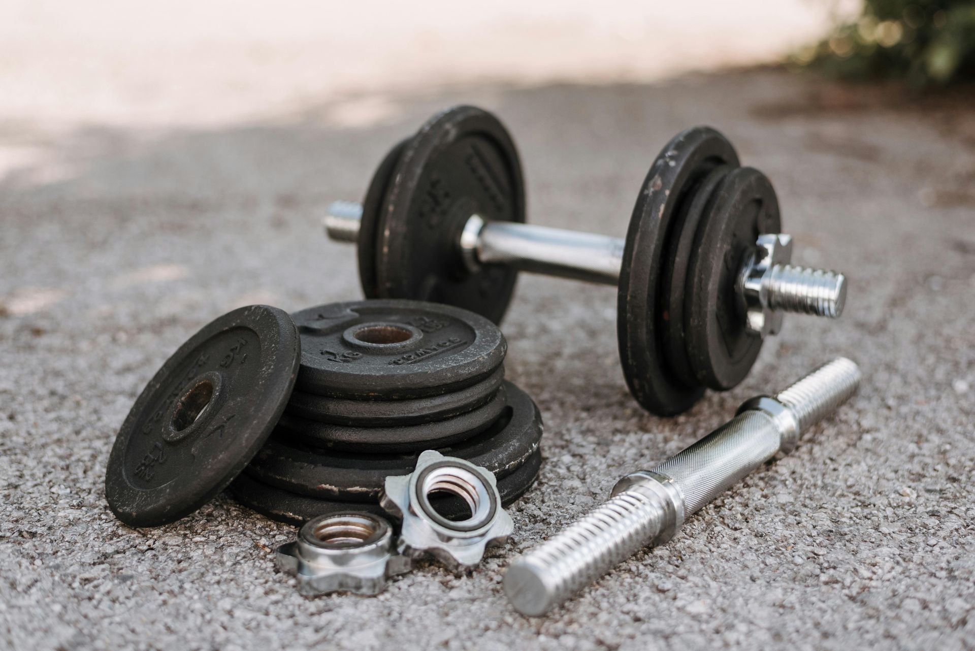 Adjustable dumbbells on the floor outside