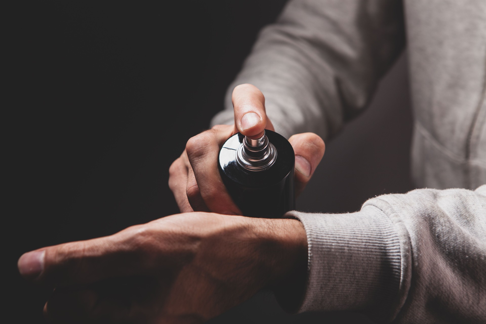 hand with bottle of perfume