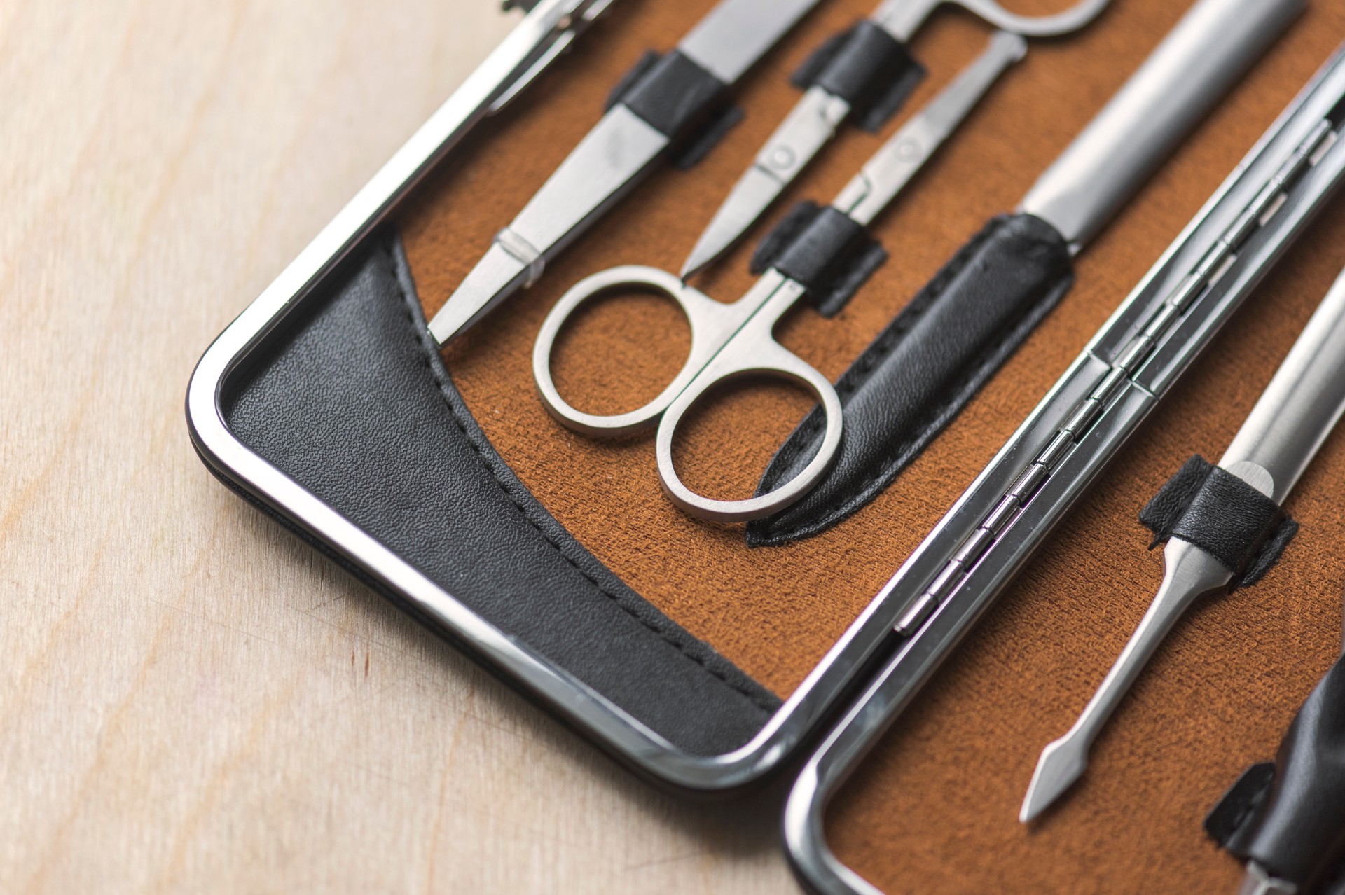 Manicure set on the wooden background